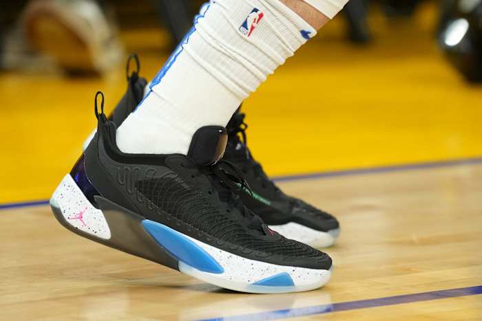 View of black and blue Jordan Luka shoes.