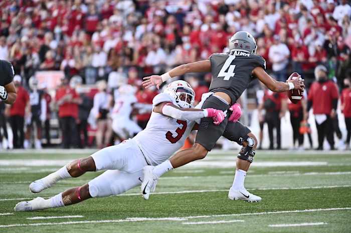 Washington State Cougars quarterback Jayden de Laura (4) is caught by Stanford Cardinal linebacker Levani Damuni (3) in the first half at Gesa Field at Martin Stadium. Jayden would be called for intentional grounding on this play.