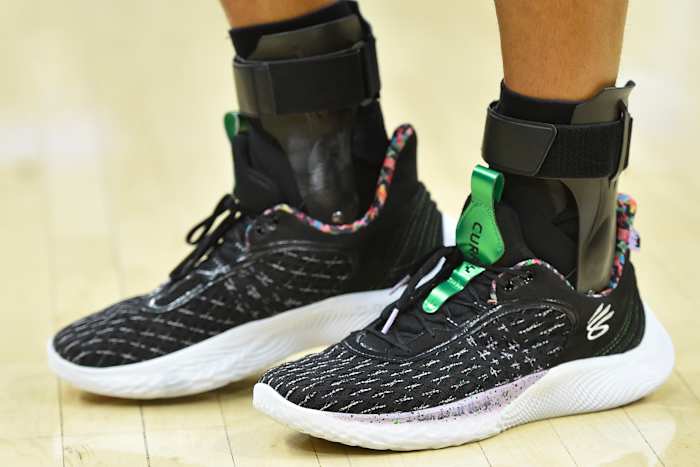 Golden State Warriors point guard Stephen Curry wearing the Sesame Street x Curry Flow 9 'Street Pack - Count It'