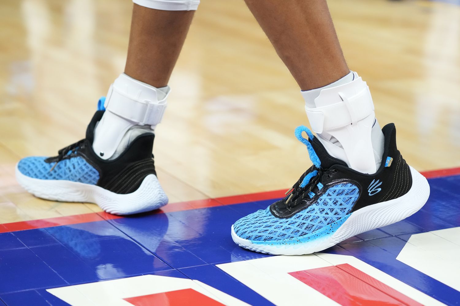 Golden State Warriors point guard Stephen Curry wearing the Sesame Street x Curry Flow 9 'Cookie Monster'.