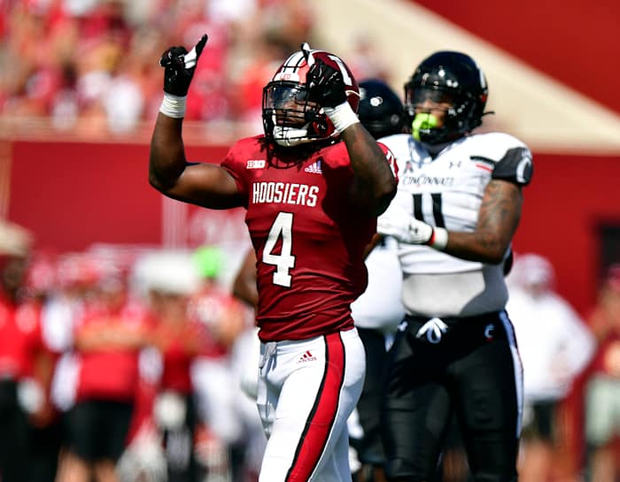 Cam Jones motions the number one after stopping a run during the first quarter against the Cincinnati Bearcats at Memorial Stadium.