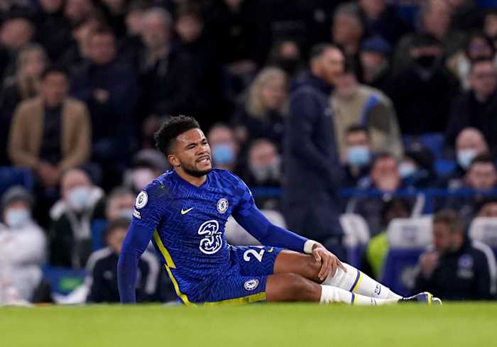 Chelsea right-back Reece James pictured holding his left knee after picking up an injury against Brighton in December 2021