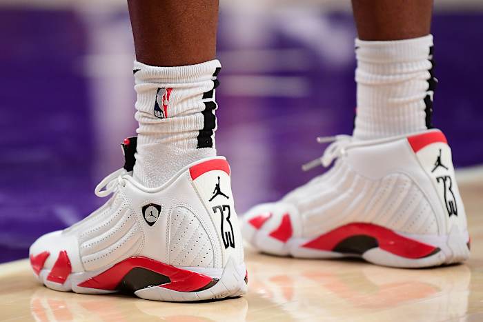 View of white and red Air Jordan sneakers.