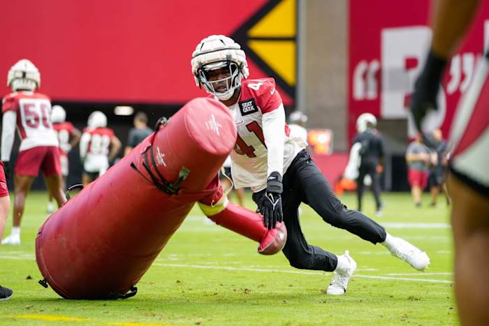 Arizona Cardinals outside linebacker Myjai Sanders (41) pushes over a tackling dummy during the Cardinals first public practice of the season at State Farm Stadium in Glendale on July 30, 2022. Nfl Cardinals Back Together Saturday Practice