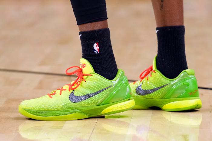 View of green Nike Kobe shoes.
