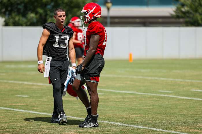 Stetson Bennett and Kearis Jackson talk strategy at practice.