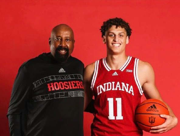 Indiana recruiting target Jamie Kaiser Jr. poses with coach Mike Woodson during his official visit to Indiana on July 25.