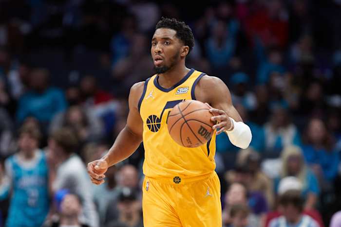 Donovan Mitchell dribbles the ball.