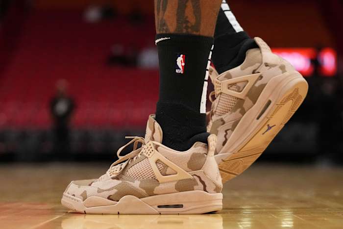 Miami Heat forward P.J. Tucker wears the Air Jordan 4 'Camo' sneakers against the New Orleans Pelicans on November 17, 2021.