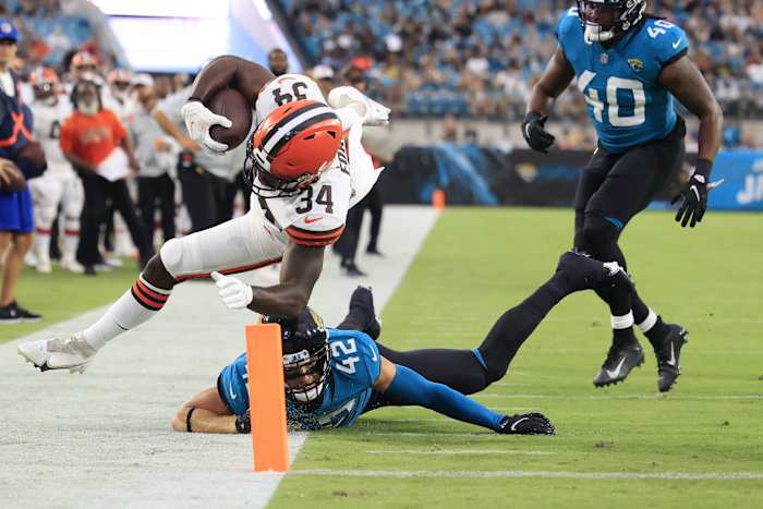 Cleveland Browns running back Jerome Ford (34) is shoved out of bounds by Jacksonville Jaguars safety Andrew Wingard (42) at the 2-yard line during the second quarter of a preseason NFL game Friday, Aug. 12, 2022 at TIAA Bank Field in Jacksonville. [Corey Perrine/Florida Times-Union] Jacksonville Jaguars 2022 Cleveland Browns First Home Pre Season Scrimmage Second Scrimmage Preseason