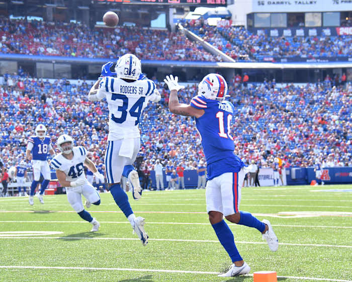 Aug 13, 2022; Orchard Park, New York, USA; Indianapolis Colts cornerback Isaiah Rodgers (34) makes an interception over Buffalo Bills wide receiver Khalil Shakir (10) in the second quarter pre-season game at Highmark Stadium. Mandatory Credit: Mark Konezny-USA TODAY Sports