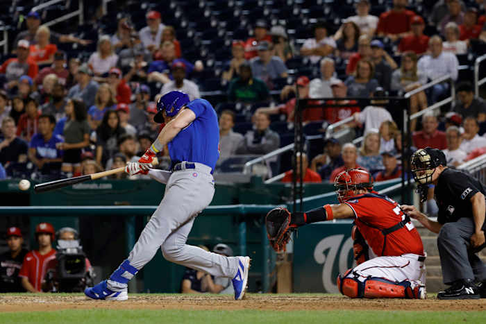 Patrick Wisdom plates the go-ahead run in the top of the 11th inning.