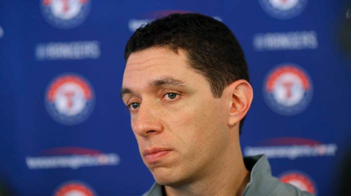 FILE - Texas Rangers general manager Jon Daniels speaks to reporters during baseball spring training in Surprise, Ariz., Feb. 15, 2018. Daniels is out as president of baseball operations for the Texas Rangers after 17 years leading the club. Team owner Ray Davis said Wednesday, Aug. 17, 2022, that Daniels was being relieved of his duties immediately after the decision was made not to renew his contract at the end of the season.