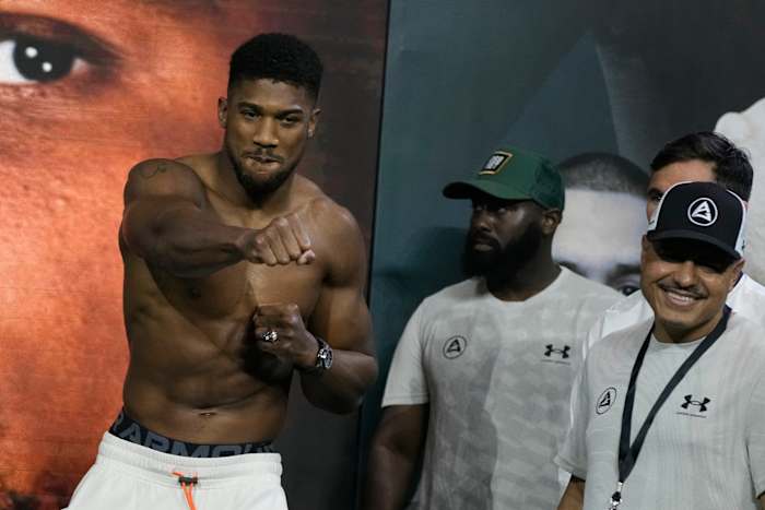 Heavyweight boxer Great Britain’s Anthony Joshua (left) gestures during the weigh-in at King Abdullah Sports City in Jeddah, Saudi Arabia.