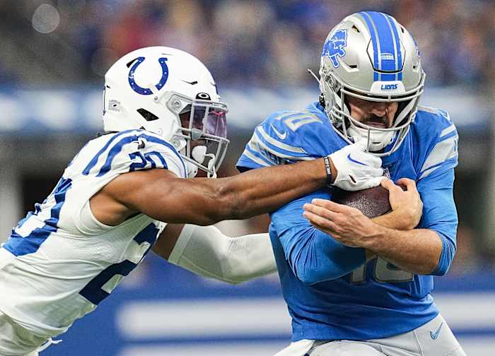 Detroit Lions quarterback David Blough (10) rushes up the Indianapolis Colts safety Nick Cross (20) on Saturday, August 20, 2022 at Lucas Oil Stadium in Indianapolis. The Indianapolis Colts and Detroit Lions are tied at the half, 13-13. Nfl Detroit Lions At Indianapolis Colts