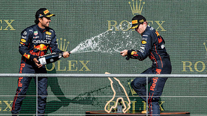 Oracle Red Bull Racing Mexican rider Sergio Perez and Oracle Red Bull Racing Dutch rider Max Verstappen celebrate after the F1 Grand Prix of Belgium