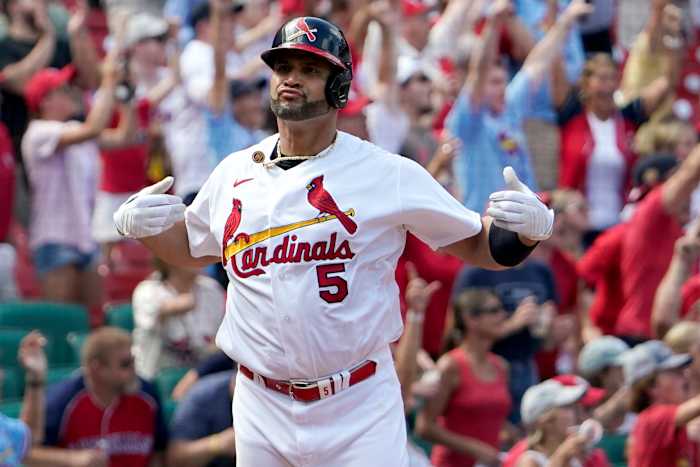 St. Louis Cardinals’ Albert Pujols celebrates after hitting a three-run home run during the eighth inning of a baseball game against the Milwaukee Brewers Sunday, Aug. 14, 2022, in St. Louis.