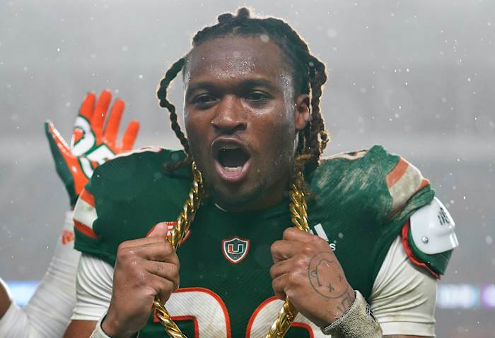 Nov 20, 2021; Miami Gardens, Florida, USA; Miami Hurricanes cornerback Marcus Clarke (28) celebrates with the turnover chain after recovering the fumble of Virginia Tech Hokies quarterback Braxton Burmeister (not pictured) during the second half at Hard Rock Stadium.