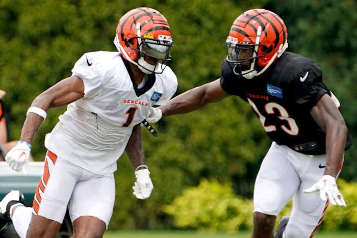 Cincinnati Bengals safety Dax Hill (23) defends Cincinnati Bengals wide receiver Ja'Marr Chase (1) during Cincinnati Bengals training camp practice, Thursday, Aug. 4, 2022, at the Paul Brown Stadium practice fields in Cincinnati. Cincinnati Bengals Training Camp Aug 4 0033