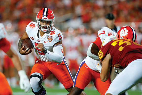 Clemson QB D.J. Uiagalelei runs against the Iowa St. Cyclones.