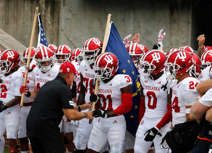 Members of the No. 17-ranked Indiana football team take the field prior to kickoff against Iowa at Kinnick Stadium in Iowa City on Saturday, Sept. 4, 2021