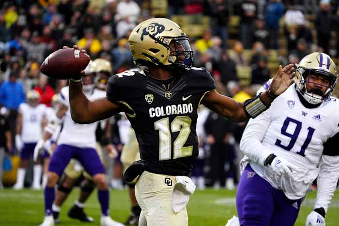 Nov 20, 2021; Boulder, Colorado, USA; Colorado Buffaloes quarterback Brendon Lewis (12) prepares to pass in the third quarter against the Washington Huskies at Folsom Field. Mandatory Credit: Ron Chenoy-USA TODAY Sports