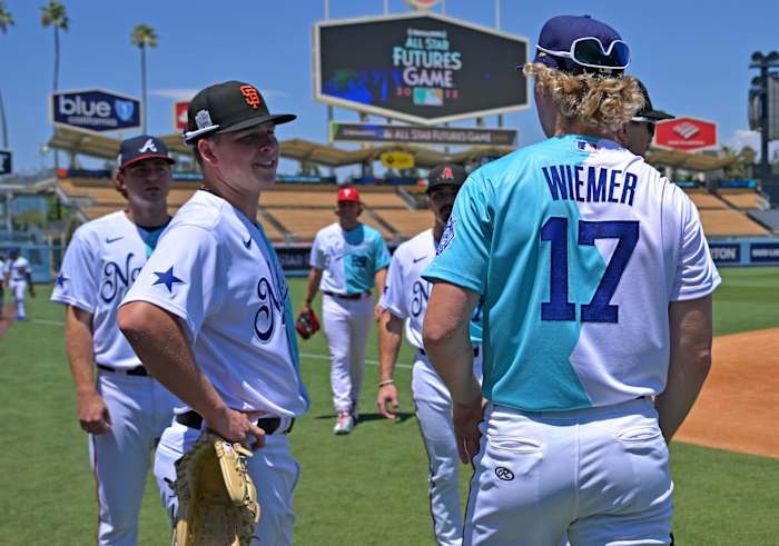 SF Giants prospect Kyle Harrison talks on the field before the All Star-Futures Game at Dodger Stadium. (2022)