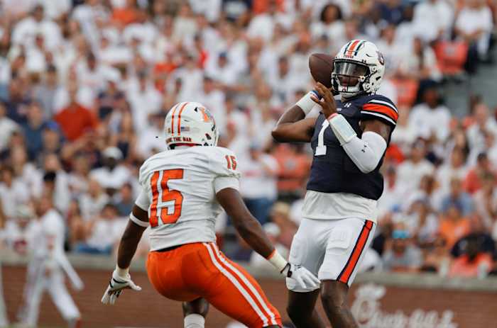 Sep 3, 2022; Auburn, Alabama, USA; Auburn Tigers quarterback T.J. Finley (1) drops back to pass as Mercer Bears linebacker Ken Standley (15) closes in during the first quarter at Jordan-Hare Stadium. Mandatory Credit: John Reed-USA TODAY Sports