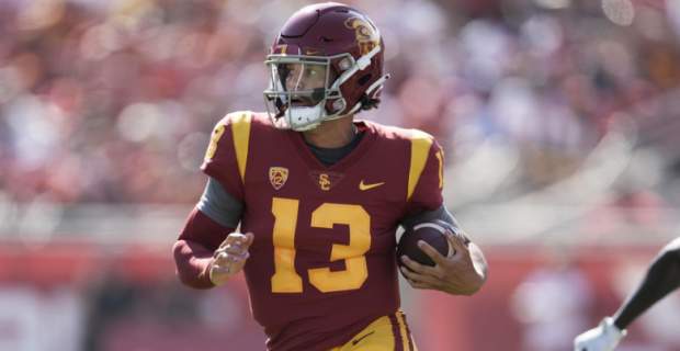 USC Trojans quarterback Caleb Williams makes a play during a college football game.