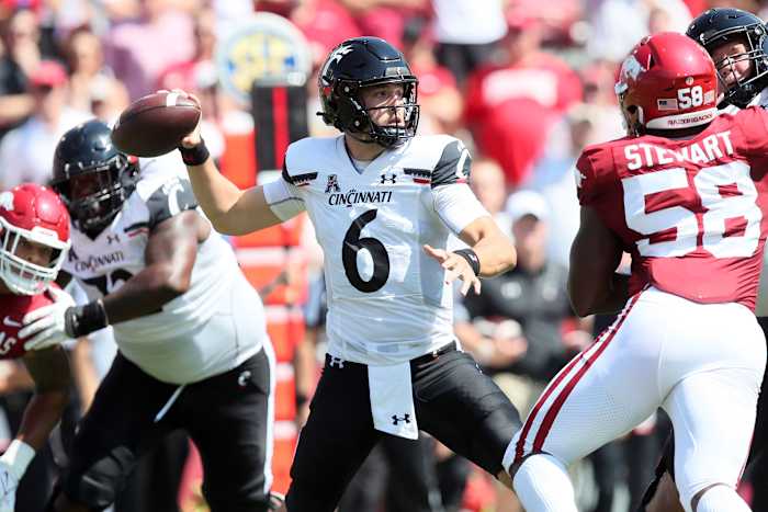 Sep 3, 2022; Fayetteville, Arkansas, USA; Cincinnati Bearcats quarterback Ben Bryant (6) passes in the first quarter against the Arkansas Razorbacks at Donald W. Reynolds Razorback Stadium. Mandatory Credit: Nelson Chenault-USA TODAY Sports