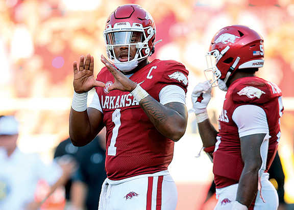 Arkansas QB KJ Jefferson signals plays against Cincinnati.