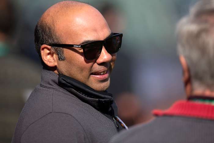 SF Giants president of baseball operations Farhan Zaidi talks with a reporter prior to a game in the 2021 NLDS.