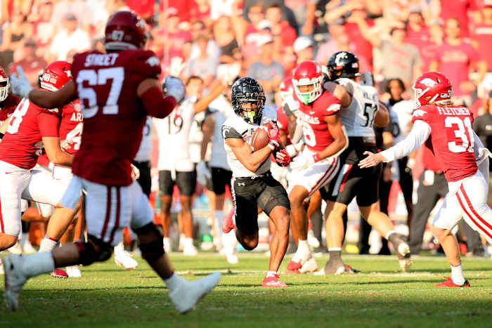Sep 3, 2022; Fayetteville, Arkansas, USA; Cincinnati Bearcats wide receiver Tre Tucker (1) runs after a catch against the Arkansas Razorbacks in the fourth quarter at Donald W. Reynolds Razorback Stadium. Arkansas won 31-24. Mandatory Credit: Nelson Chenault-USA TODAY Sports