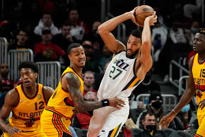 Rudy Gobert controls the ball against John Collins.
