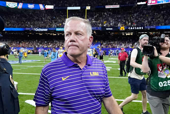 LSU coach Brian Kelly walks off field after opening-season loss.