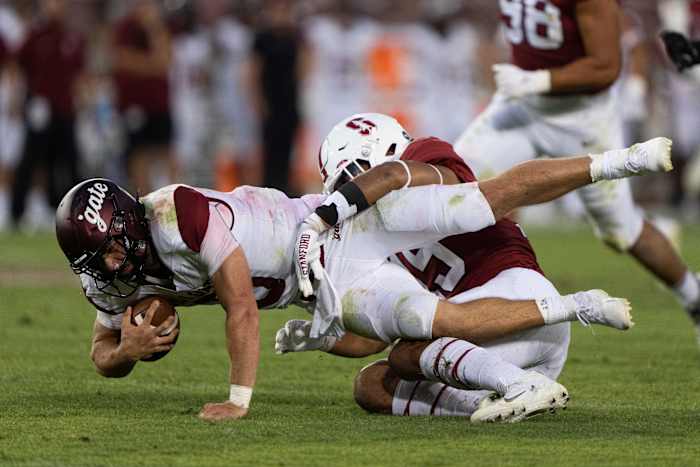 Stanford Cardinal defensive end Stephen Herron (15) sacks Colgate Raiders quarterback Michael Brescia (5) during the fourth quarter at Stanford Stadium.