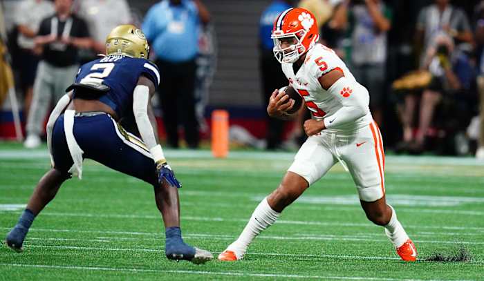 Georgia Tech linebacker Ace Eley bring down Clemson quarterback D.J. Uiagalelei