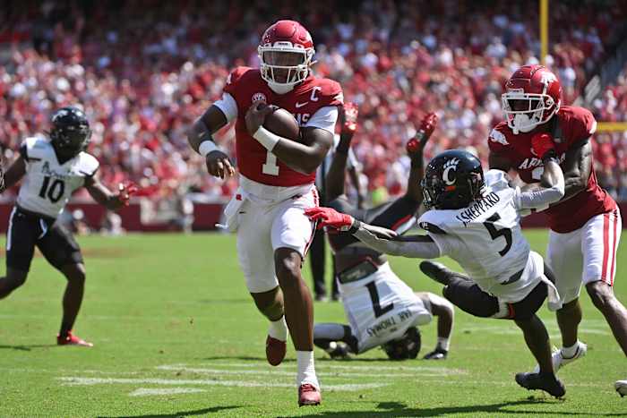 Arkansas quarterback KJ Jefferson (1) breaks through the Cincinnati defense to score a touchdown during an NCAA college football game Saturday, Sept. 3, 2022, in Fayetteville, Ark. (AP Photo/Michael Woods)