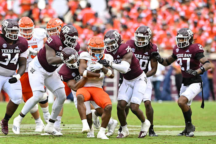 Sep 3, 2022; College Station, Texas, USA; Sam Houston State Bearkats wide receiver Noah Smith (6) is wrapped up by Texas A&M Aggies linebacker Chris Russell Jr. (24) during the third quarter at Kyle Field. Mandatory Credit: Maria Lysaker-USA TODAY Sports