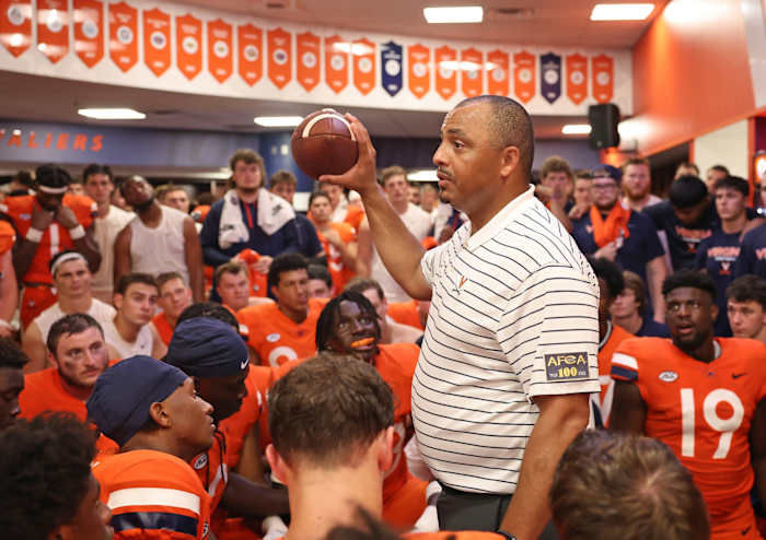 Virginia head coach Tony Elliott addresses his team in the locker room after UVA defeated Richmond 34-17.