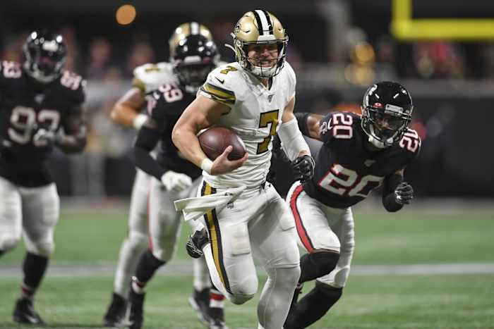 New Orleans Saints Taysom Hill (7) runs through the Atlanta Falcons defense for a touchdown. Mandatory Credit: Dale Zanine-USA TODAY