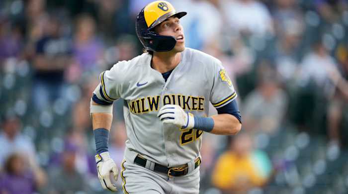 Milwaukee Brewers’ Christian Yelich follows the flight of his solo home run off Colorado Rockies starting pitcher Chad Kuhl in the first inning of a baseball game Tuesday, Sept. 6, 2022, in Denver.