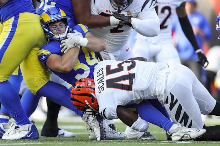 Cincinnati Bengals linebacker Tegray Scales (45) tackles Los Angeles Rams running back Jake Funk (34) in the first half at Paycor Stadium.