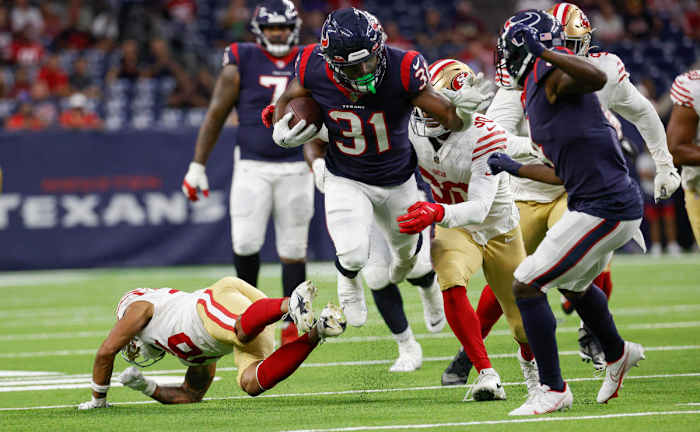 Aug 25, 2022; Houston, Texas, USA; Houston Texans running back Dameon Pierce (31) runs with the ball during the first quarter against the San Francisco 49ers at NRG Stadium. Mandatory Credit: Troy Taormina-USA TODAY Sports