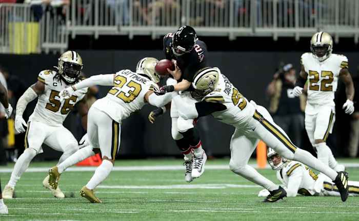 Nov 28, 2019; Atlanta Falcons quarterback Matt Ryan (2) fumbles the ball as he is hit by New Orleans Saints cornerback Marshon Lattimore (23) and defensive end Marcus Davenport (92). Mandatory Credit: Jason Getz-USA TODAY Sports