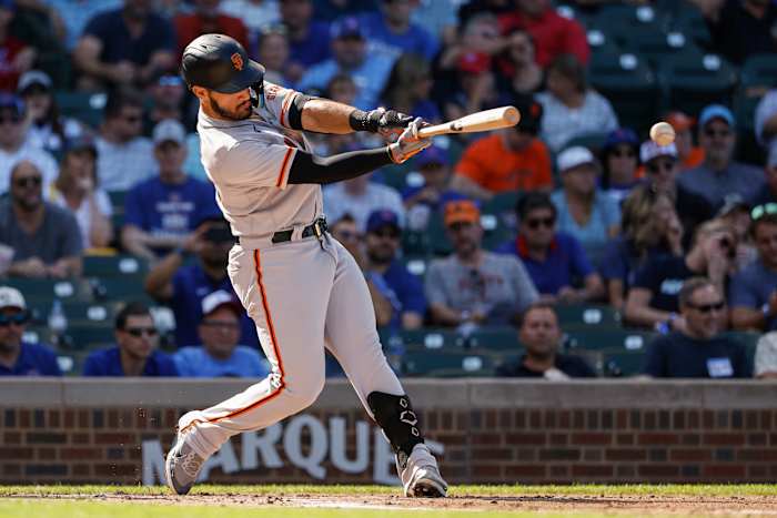 SF Giants infielder David Villar hits a double against the Cubs.