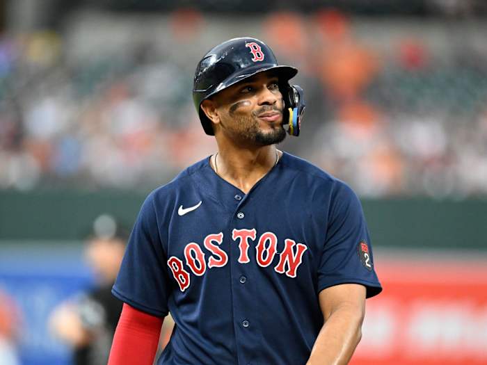 Red Sox shortstop Xander Bogaerts looks out to the crowd as he walks back to the dugout.