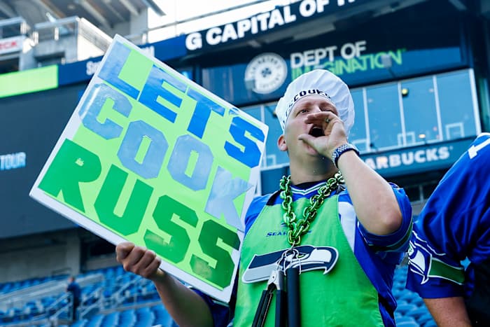A Seattle Seahawks fan cheers against Denver Broncos quarterback Russell Wilson (not pictured) during pregame warmups at Lumen Field.