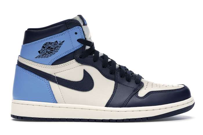 View of white, navy, light blue Jordan 1 shoes.