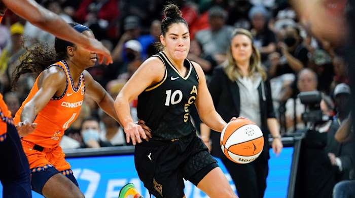 Aces guard Kelsey Plum drives the ball against Sun guard Nia Clouden during Game 2 of the WNBA Finals.